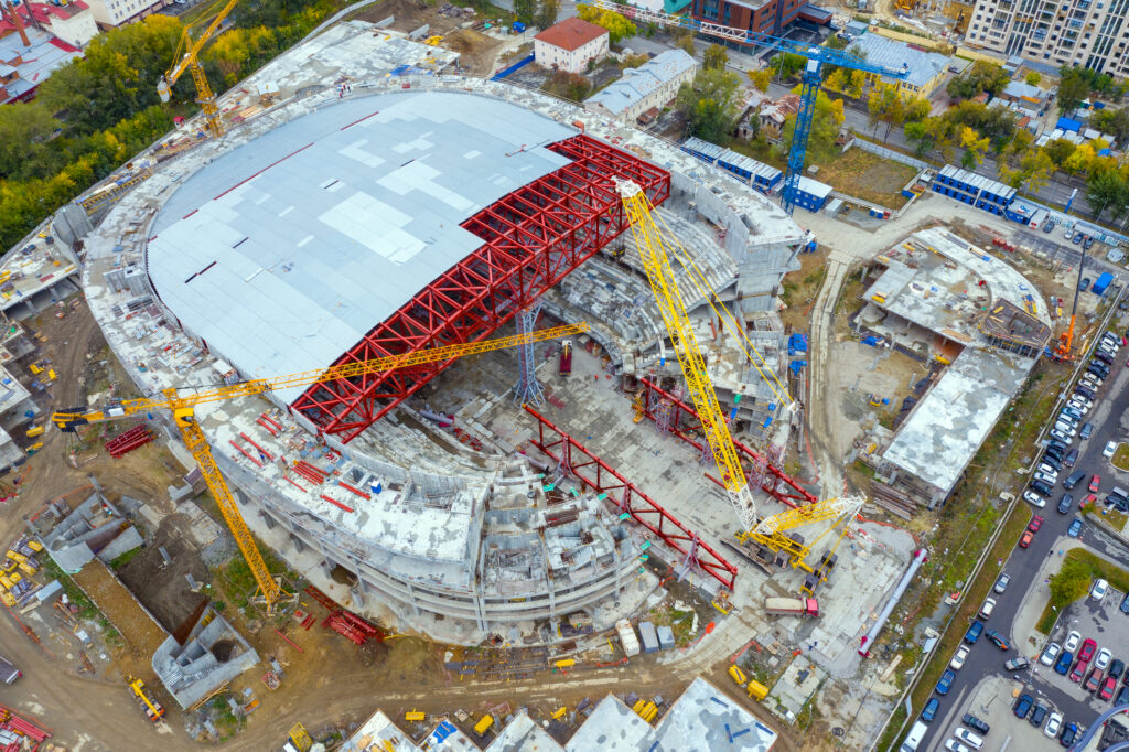 Aerial view of the construction of a new covered stadium in a modern city
